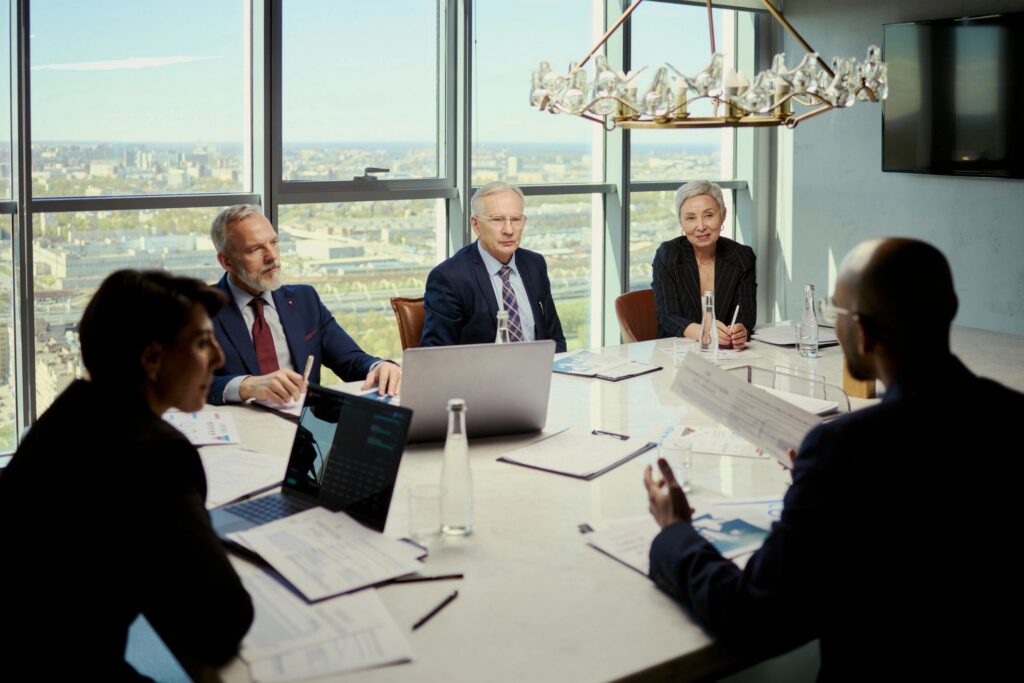 Diverse Business Team Discussing Oil Industry Strategy in Boardroom